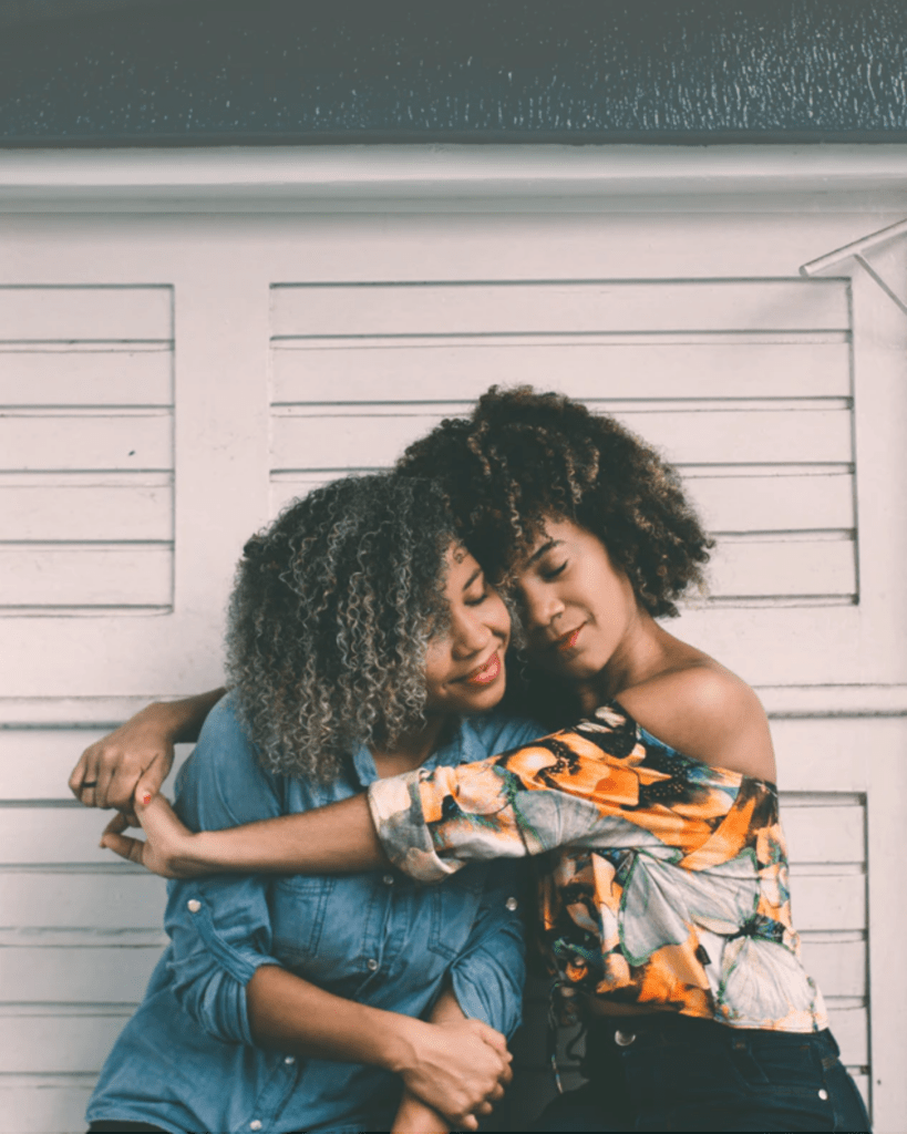 Two women entrepreneurs hugging